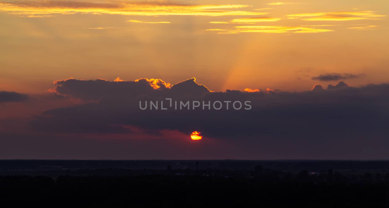 Panoramic view of the horizon and colorful sunset on the outskirts of the city by galsand