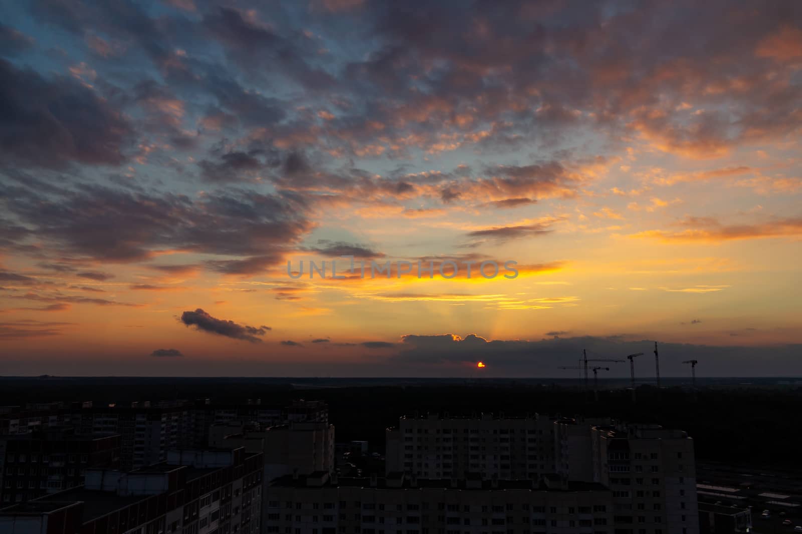 Panoramic view of the horizon and colorful sunset on the outskirts of the city by galsand