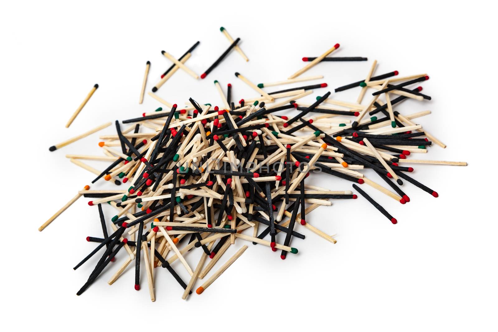 A lot of matches are mixed, of different color, isolated on white background