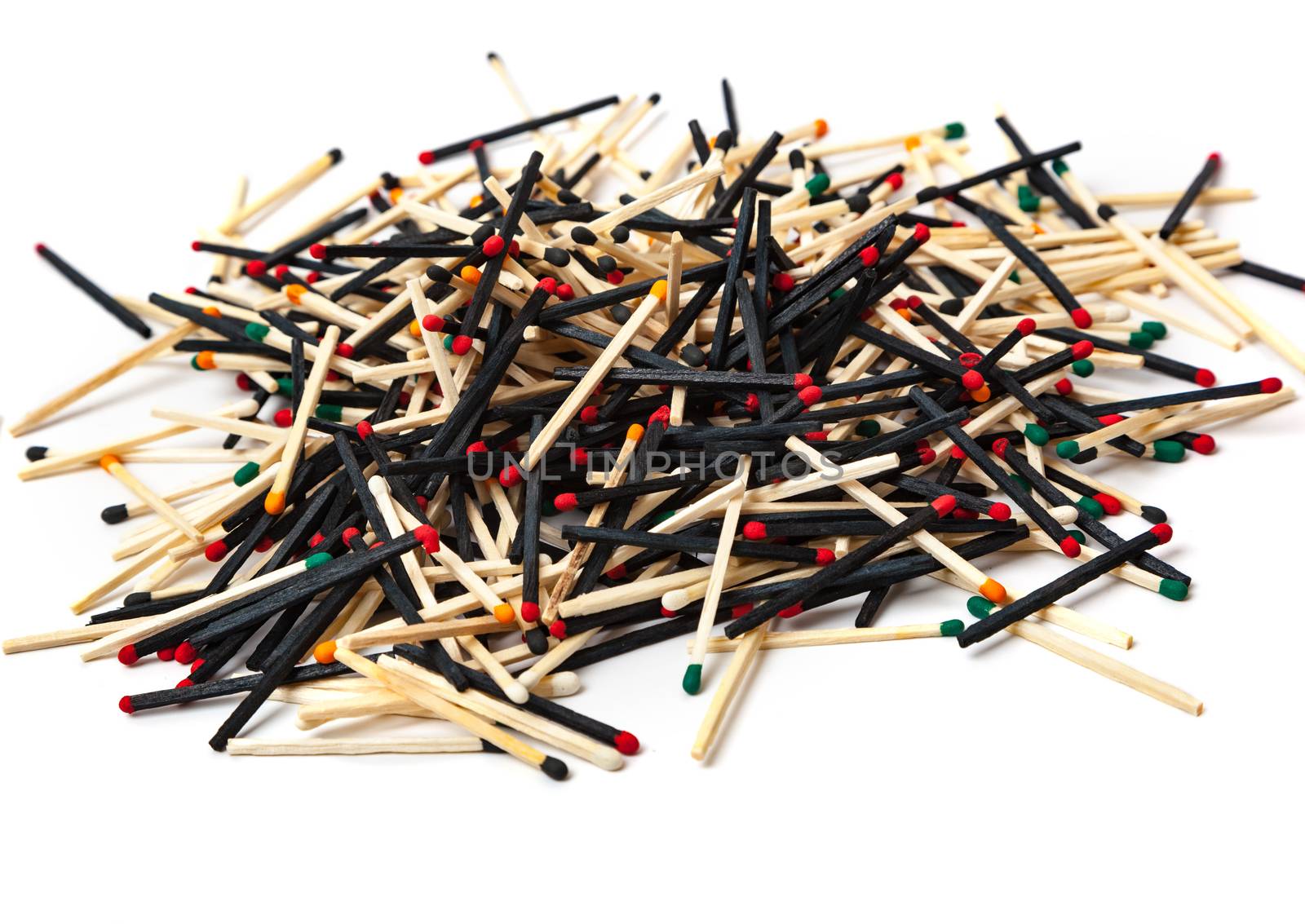 A lot of matches are mixed, of different color, isolated on white background