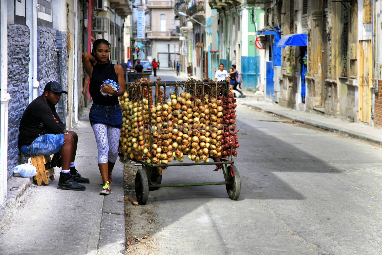 Selling onions on the street in Old Havana, Cuba by friday