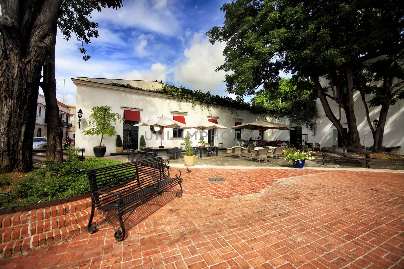 People enjoy at a street side cafe in the Zona Colonial or histo by friday