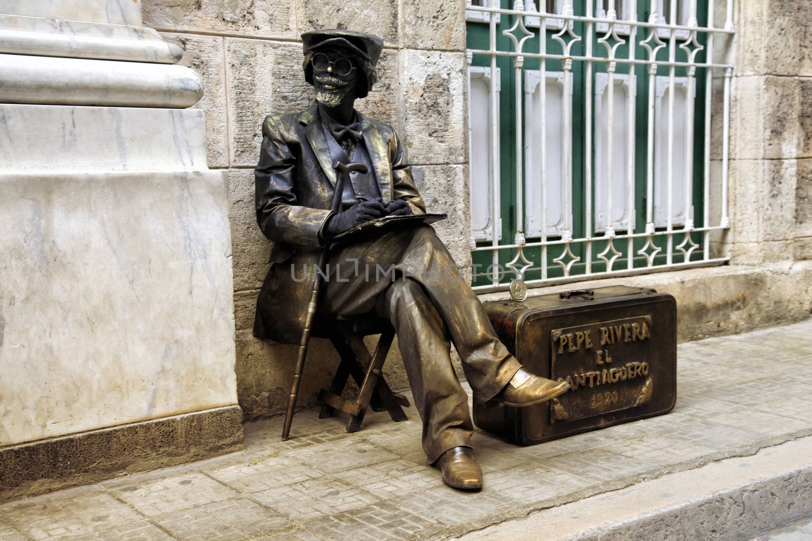 Havana, Cuba - January 11, 2019: Bronze painted artist on a city street. Havana, Cuba