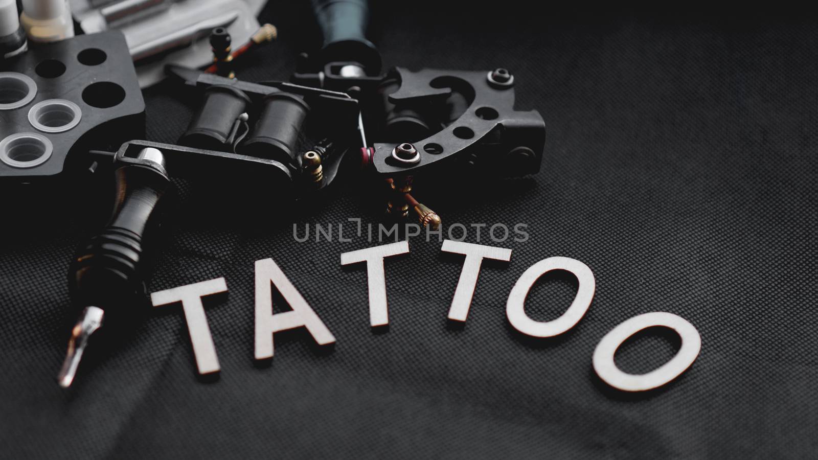 Tattoo accessories With inscription tattoo of wooden letters - black background by natali_brill