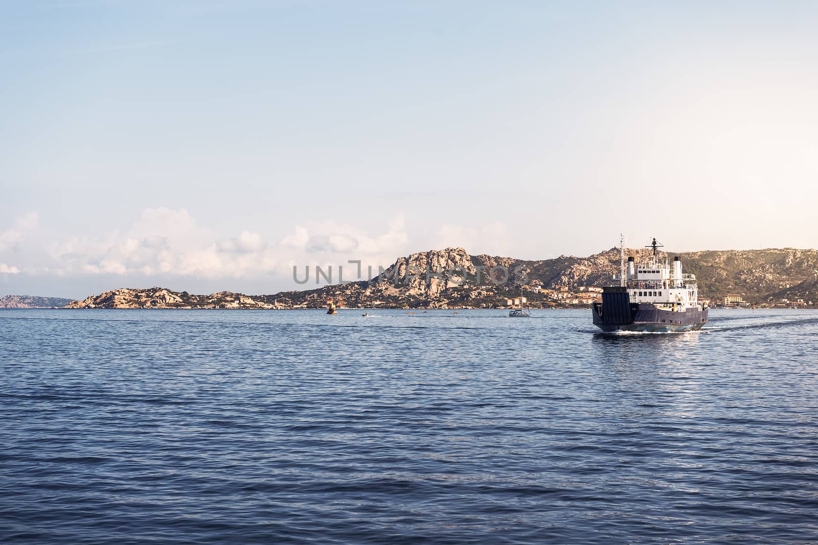 ferry boat sailing between two nearby islands, La Maddalena, Sardinia, Italy