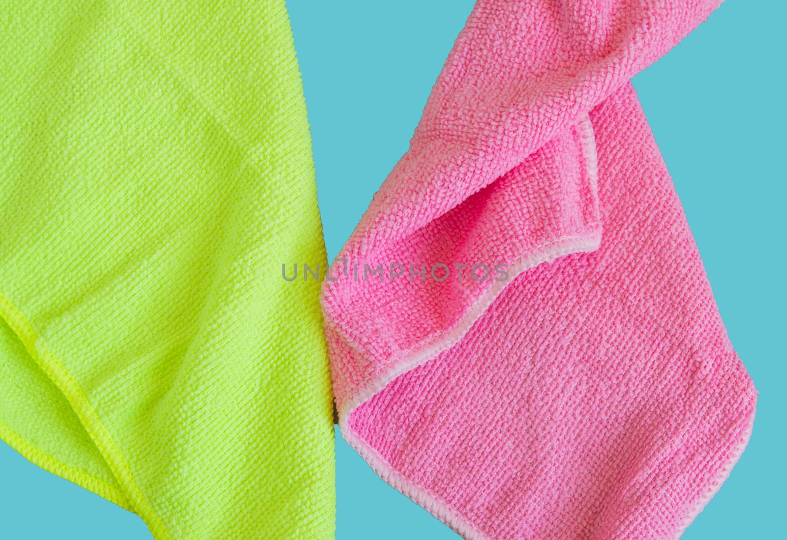 Microfiber cloths isolated on blue background, tools for cleaning and cleanliness. The concept of spring cleaning, flat lay.