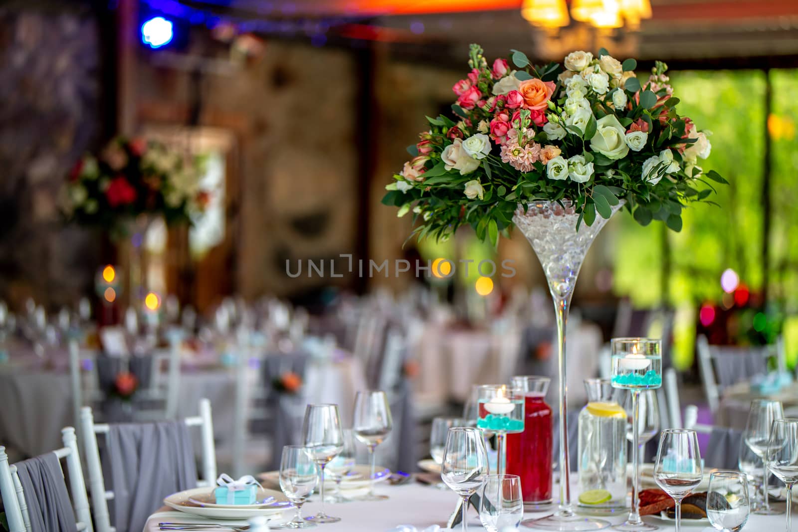 Wedding table decorated with flowers and dishes by fotorobs