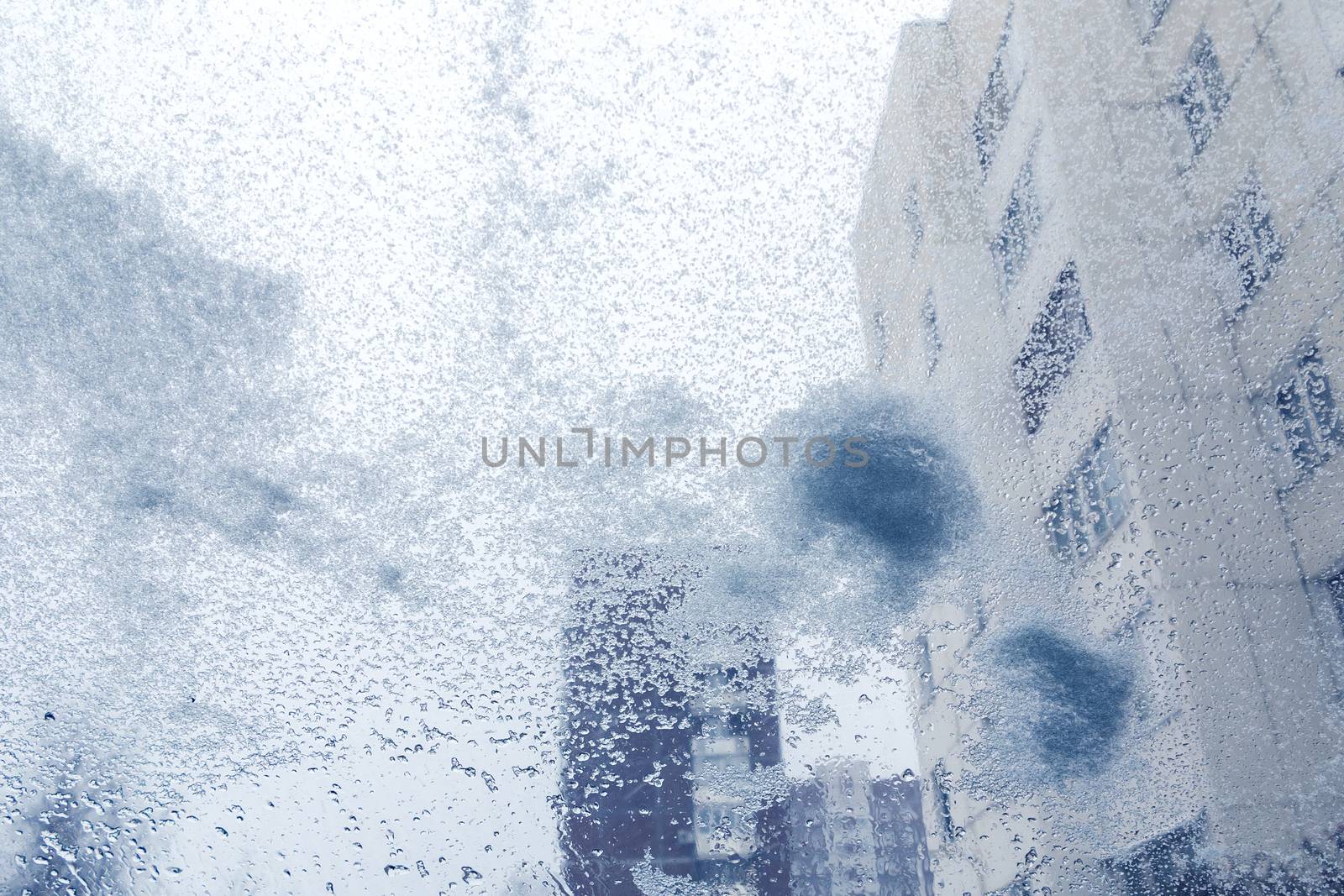 Windshield from inside the car during heavy snowfall.