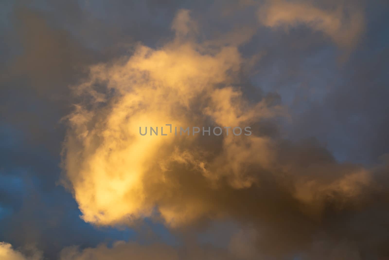 Beautiful cumulus clouds of unusual shape in the blue sky on a summer day by galsand