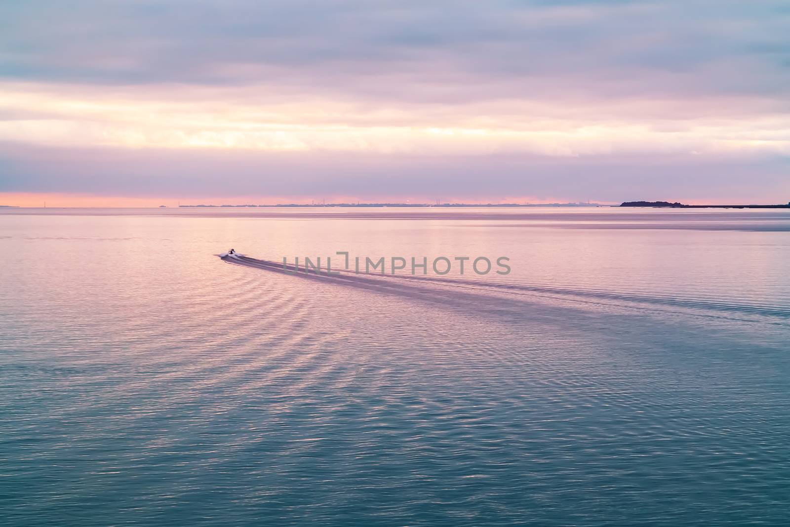 Patrol boat in the Finnish Gulf at sunset.