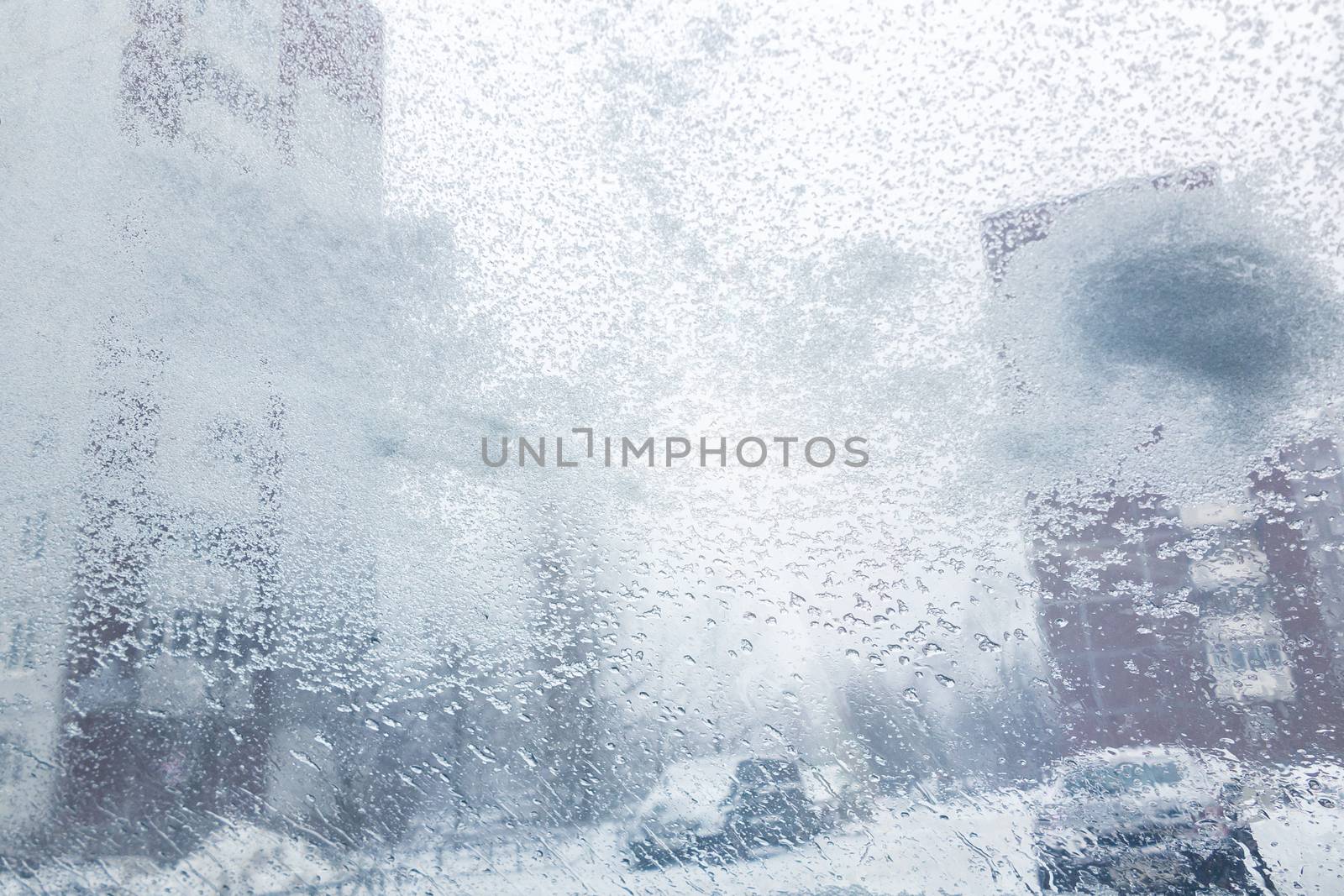 Windshield from inside the car during heavy snowfall.