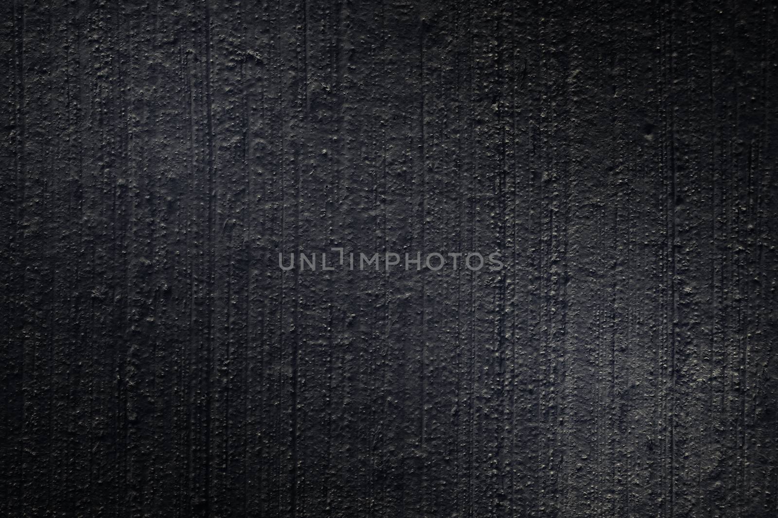 Black paint plastered concrete wall, texture, background by galsand