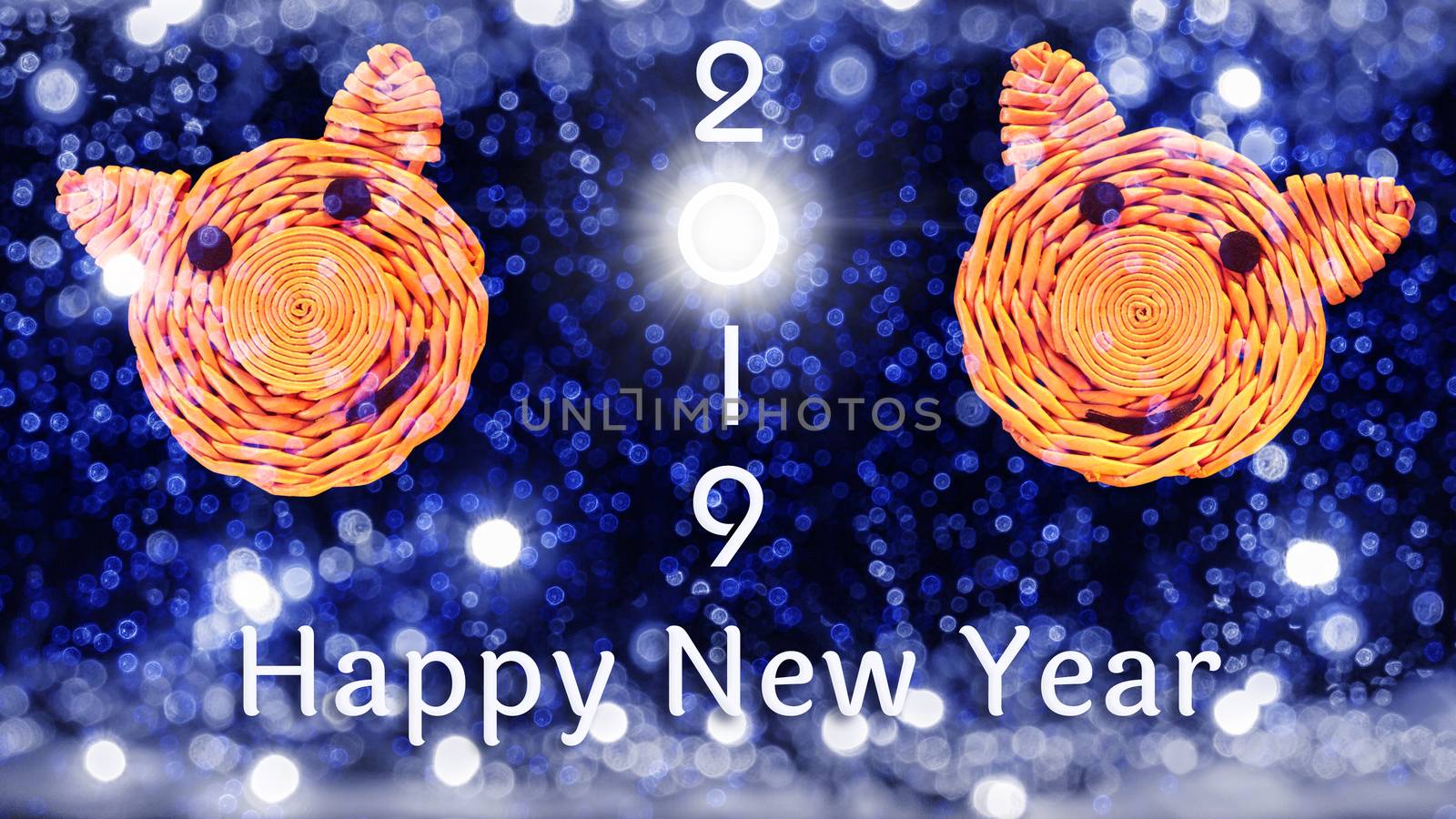 Inscription 2019, faces of pigs, the symbol of 2019 on the Chinese horoscope and congratulations on the New year against the beautiful bokeh from the lights.