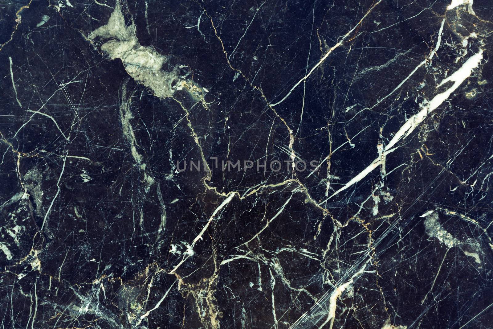 Texture of dark cracked marble, grunge background for design.