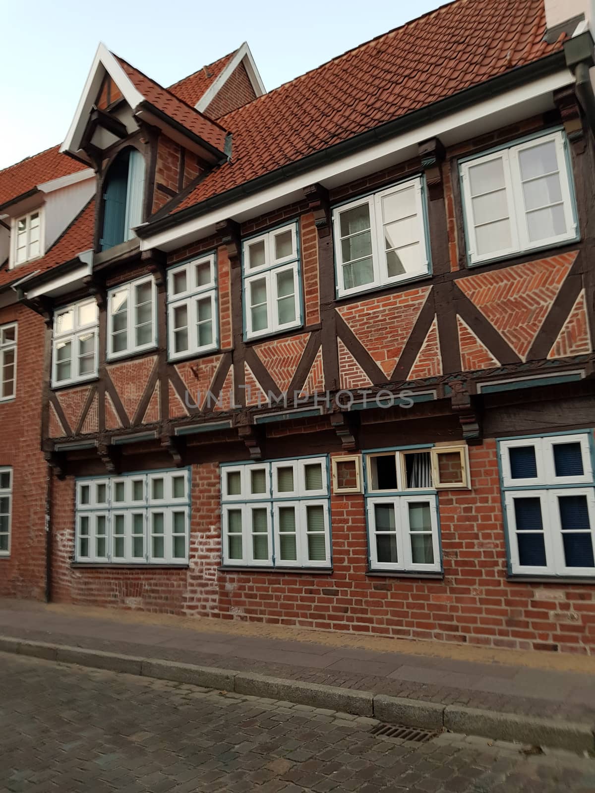 Half-timbered red brick houses near the river on the old harbor Lueneburg, Germany