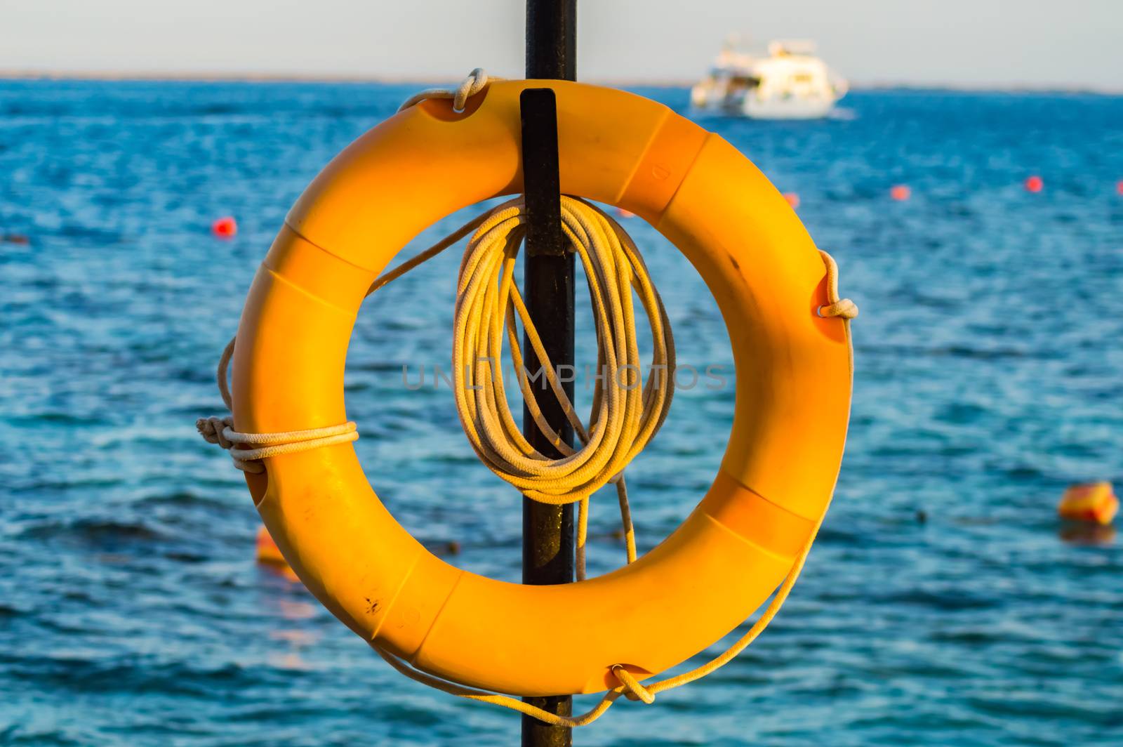 Lifebuoy hanging on a pole on the Red Sea in the city of Hurghada