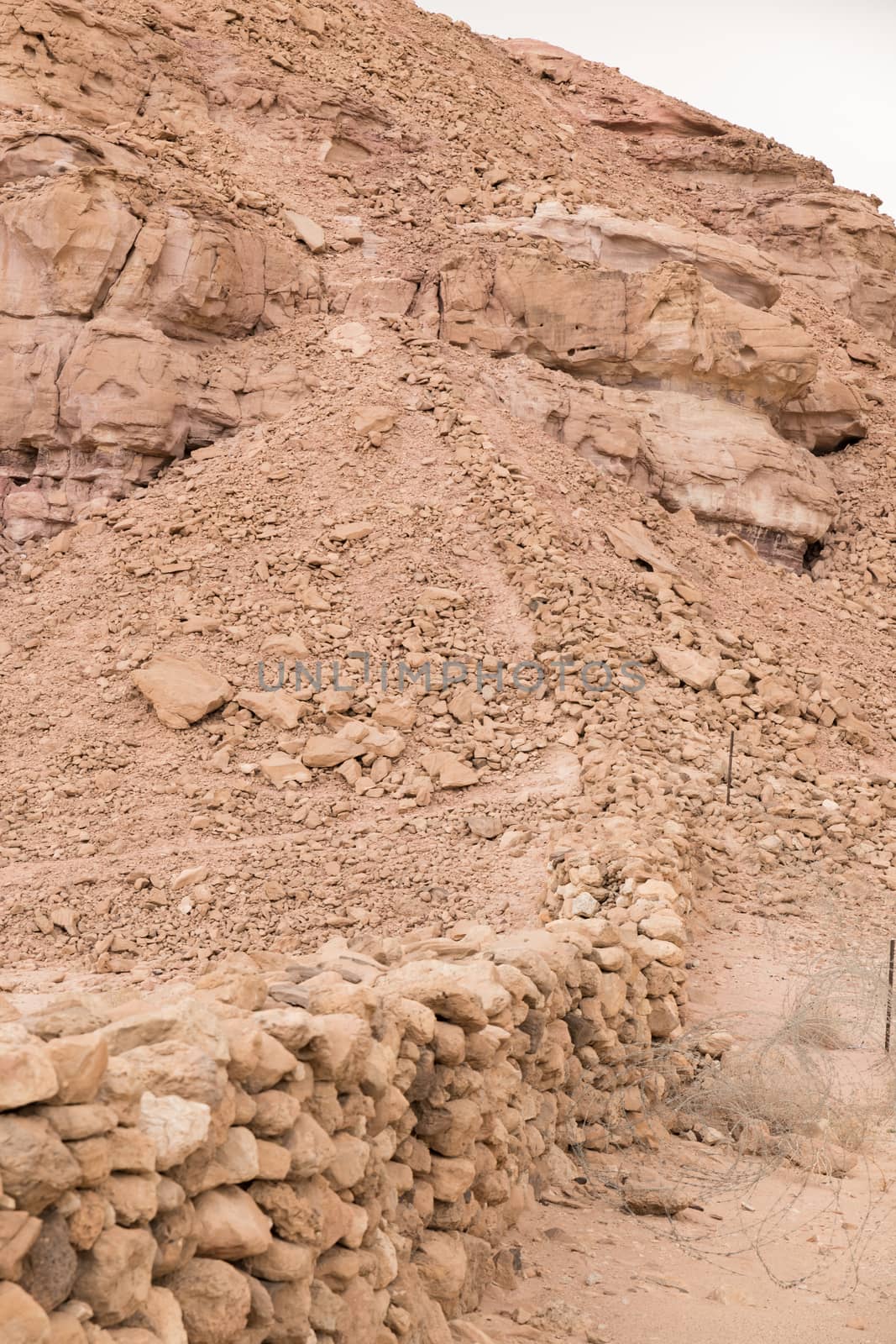 old stacked ancient original walls from stones in timna national park near eilat in israel