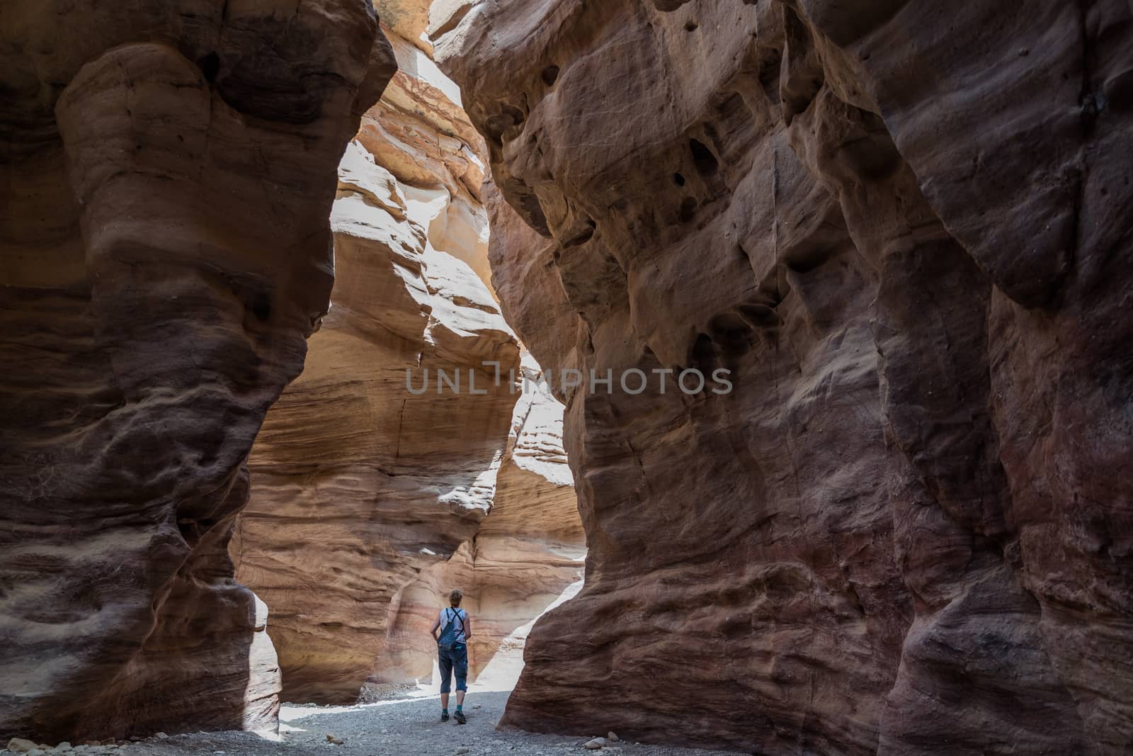 woman walking in the red canyon in israel