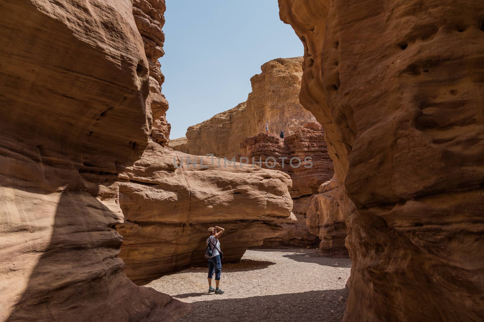 woman walking in the red canyon in israel