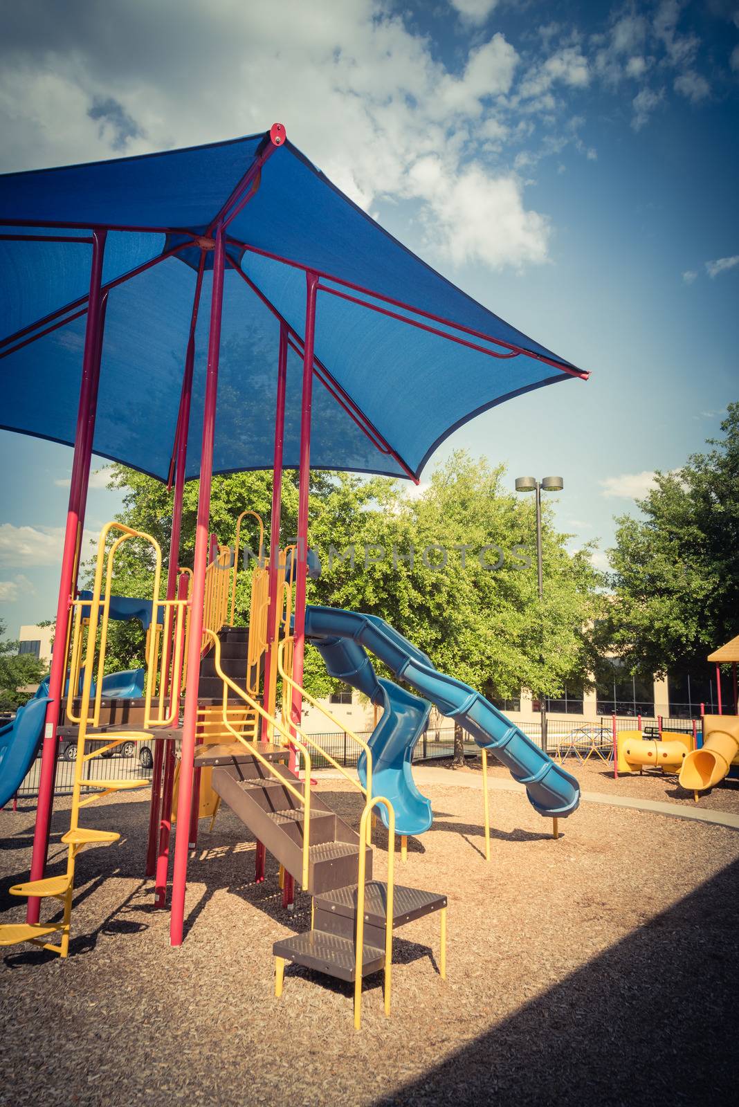 Vintage tone a colorful playground near community recreation facility in Texas, America