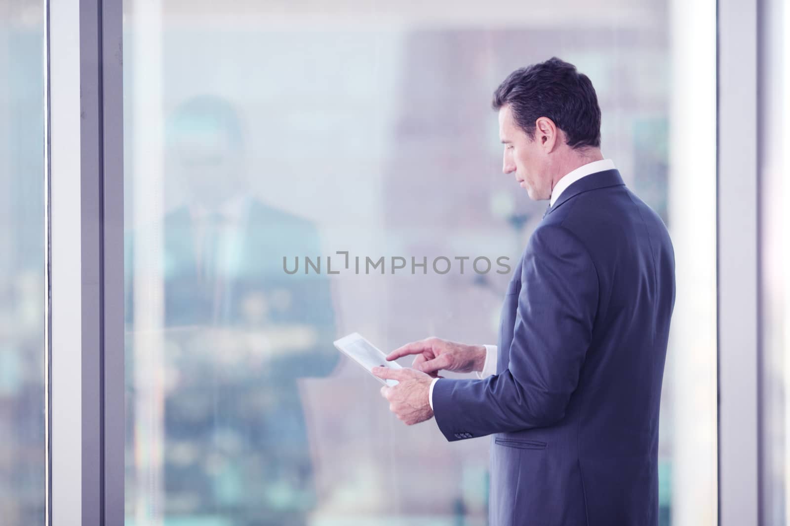 Businessman working with tablet  by ALotOfPeople