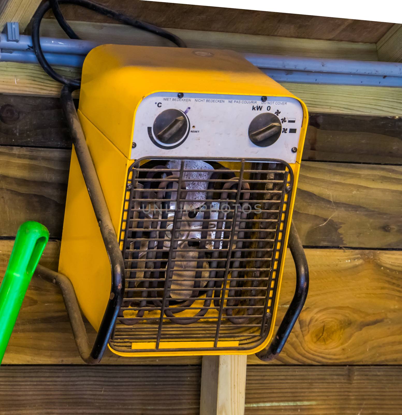 Simple electric heater hanging on a wooden wall, heating solutions by charlottebleijenberg