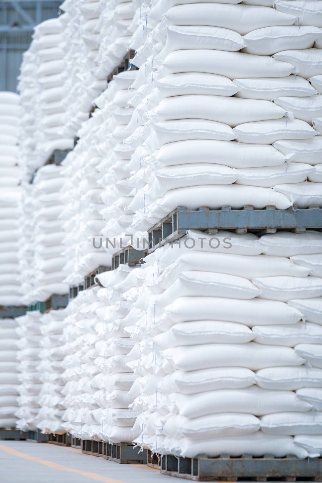 stack of white bag in the warehouse by antpkr