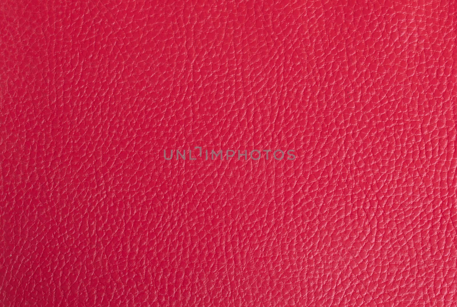 Bright red leather background, part of an old binder folder