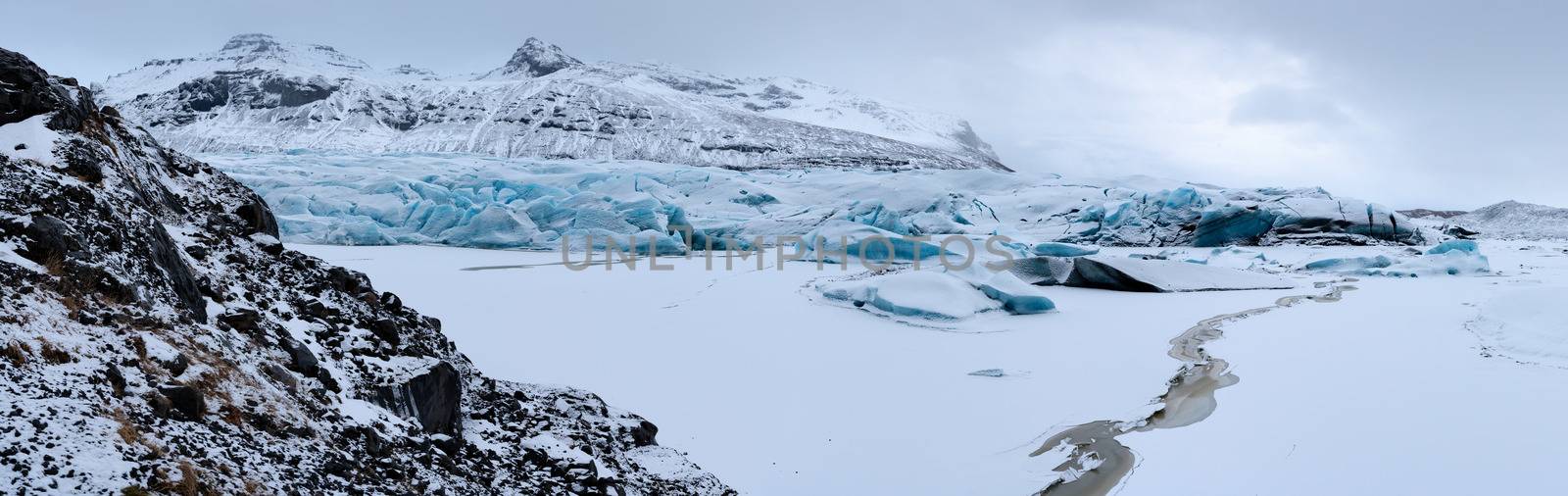 Panoramic image of the snow-coverd glacier Svinafellsjoekull on a winter day after snowfall, Iceland, Europe