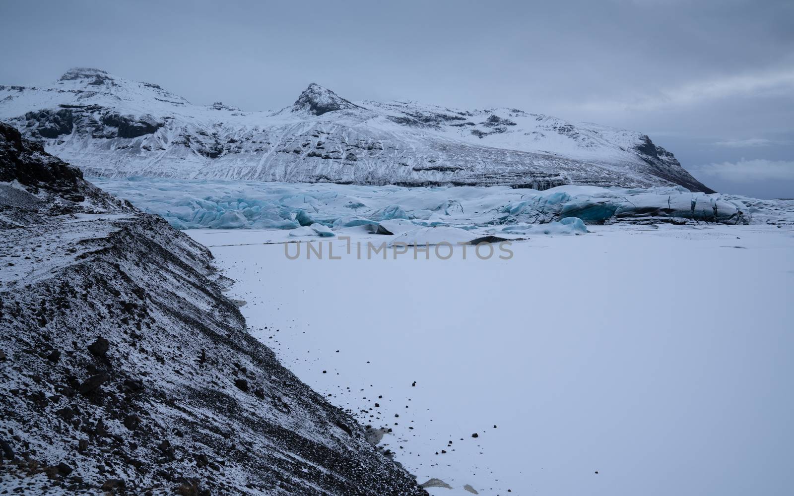 Panoramic image of the snow-coverd glacier Svinafellsjoekull on a winter day after snowfall, Iceland, Europe