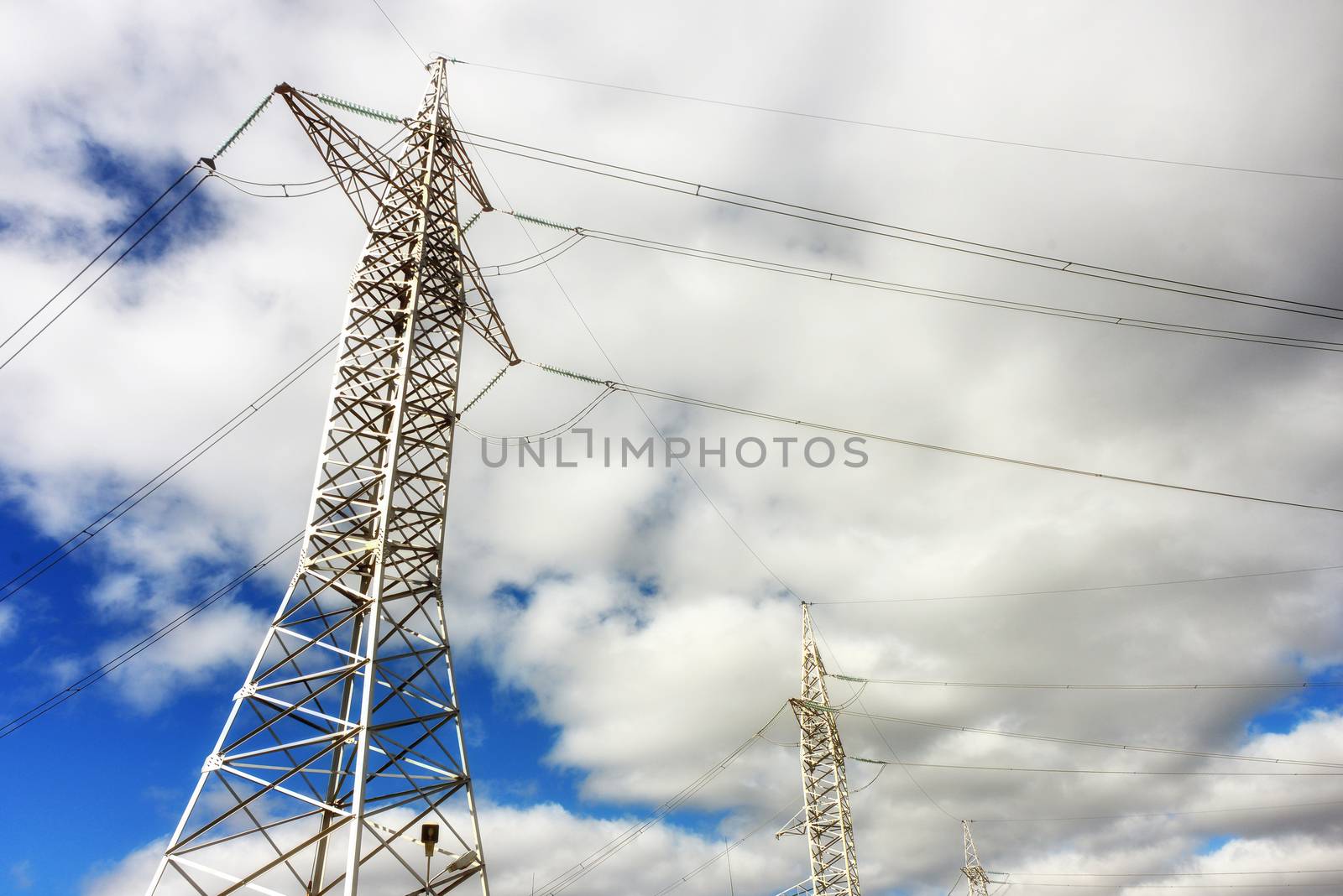 Electric power lines steel tower panoramic view silhouette of transmission