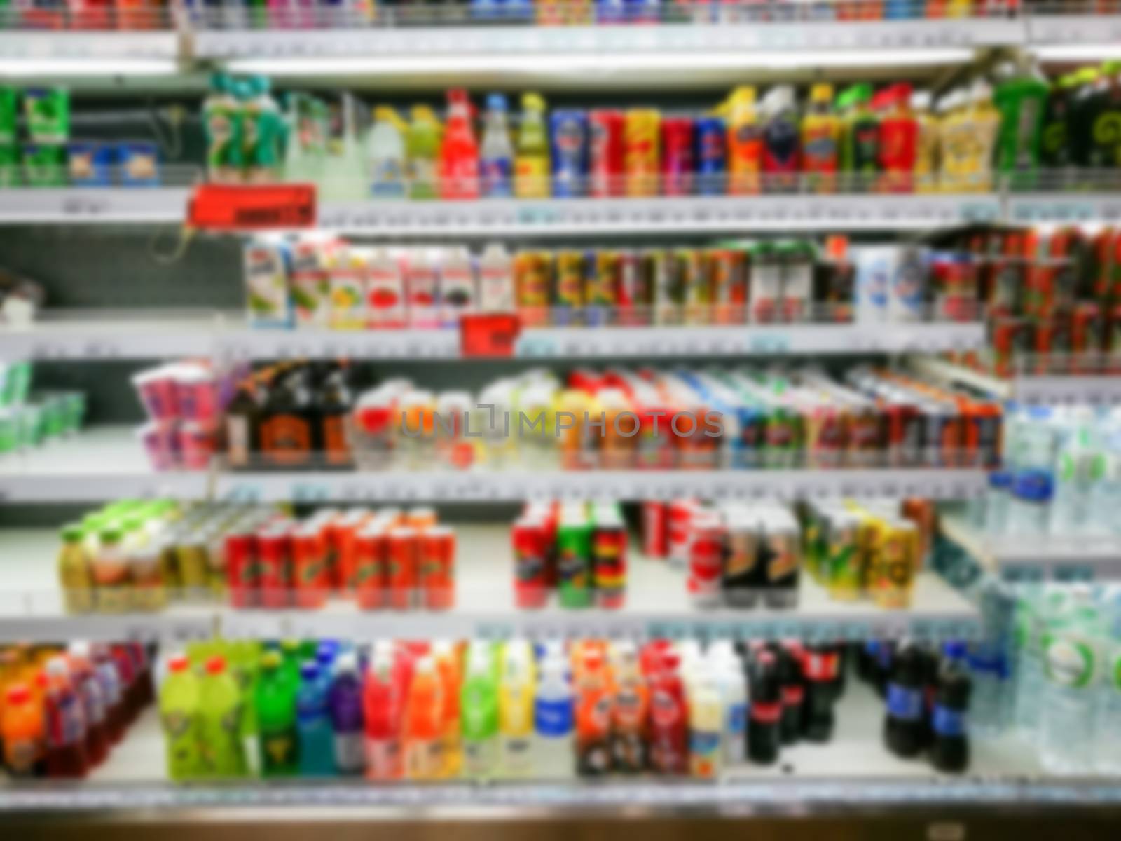 Blurred of product shelves in supermarket by yuiyuize