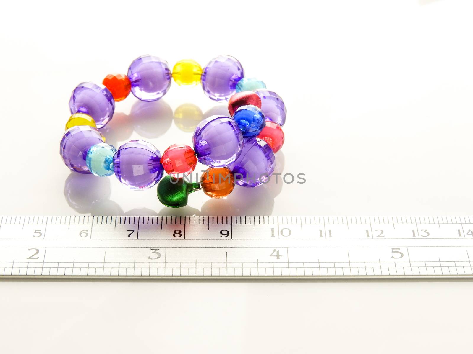 Multi-colored bracelets with beads. Colourful child's bead bracelet.
