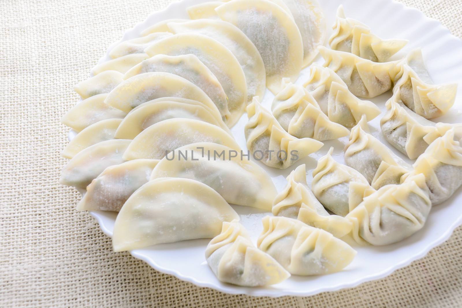 Japanese Fried Dumplings, the half moon-shaped dumplings served in Asian restaurants as an appetiser or side dish, pork and vegetable filling.
