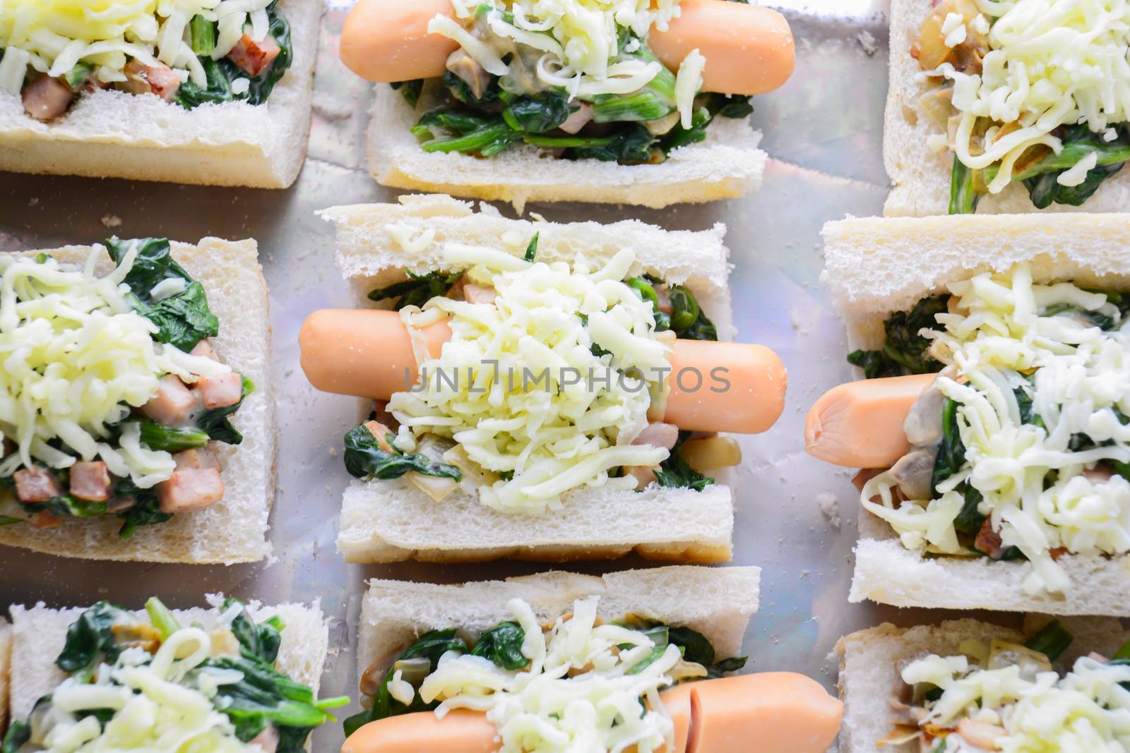 Baked Spinach with Cheese, sausage on Baguette, French bread
