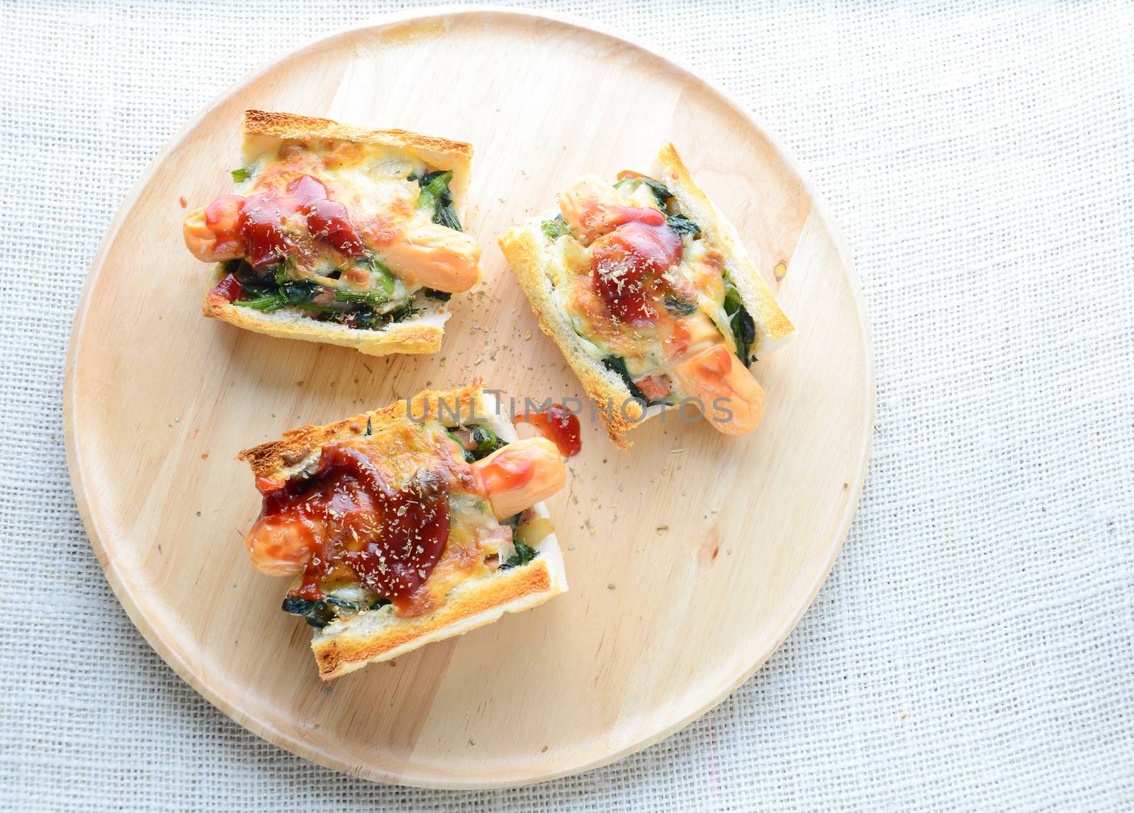 Baked Spinach with Cheese, sausage on Baguette, French bread
