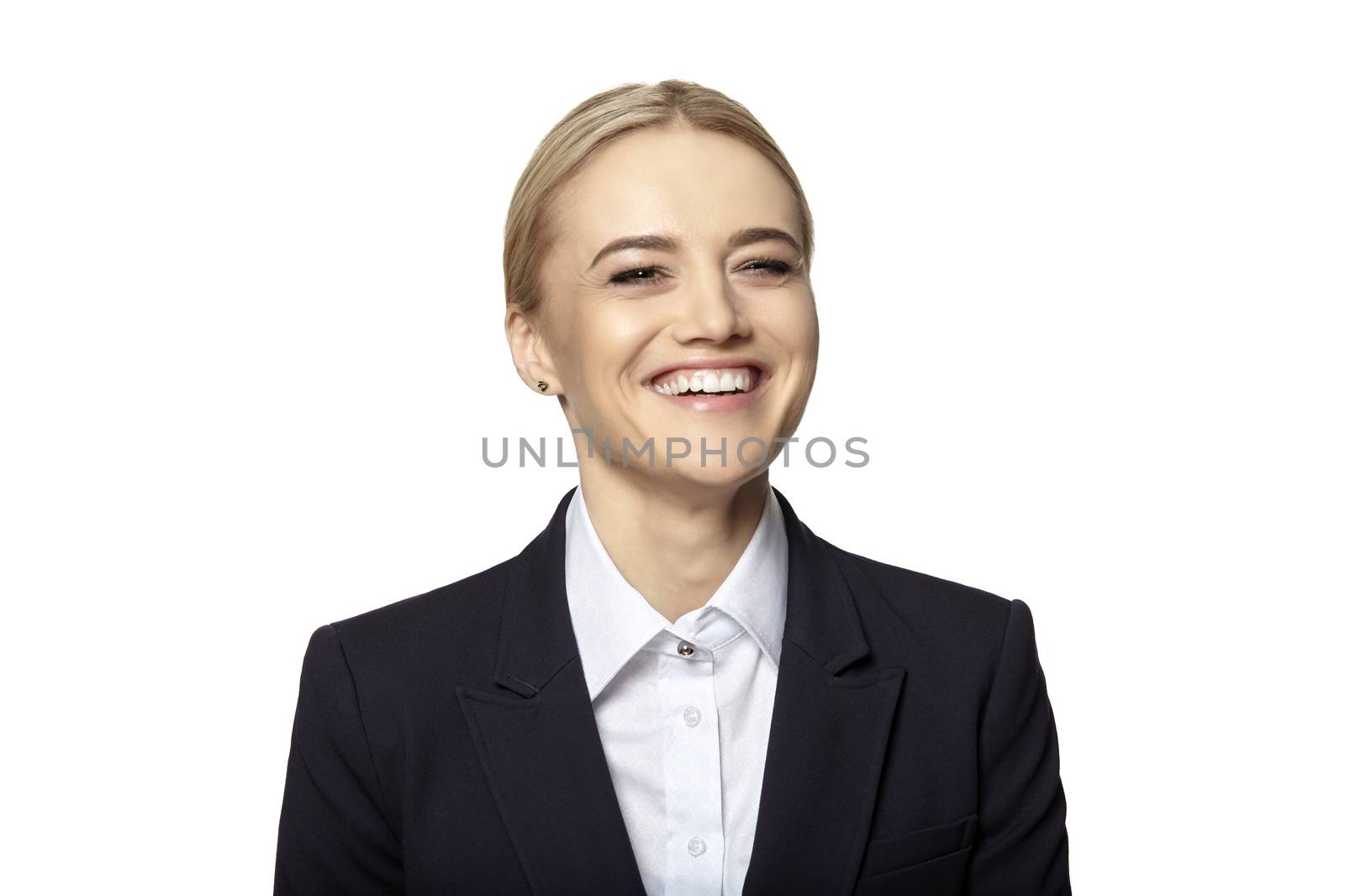 Studio shot of young blonde woman laughing isolated on white background.