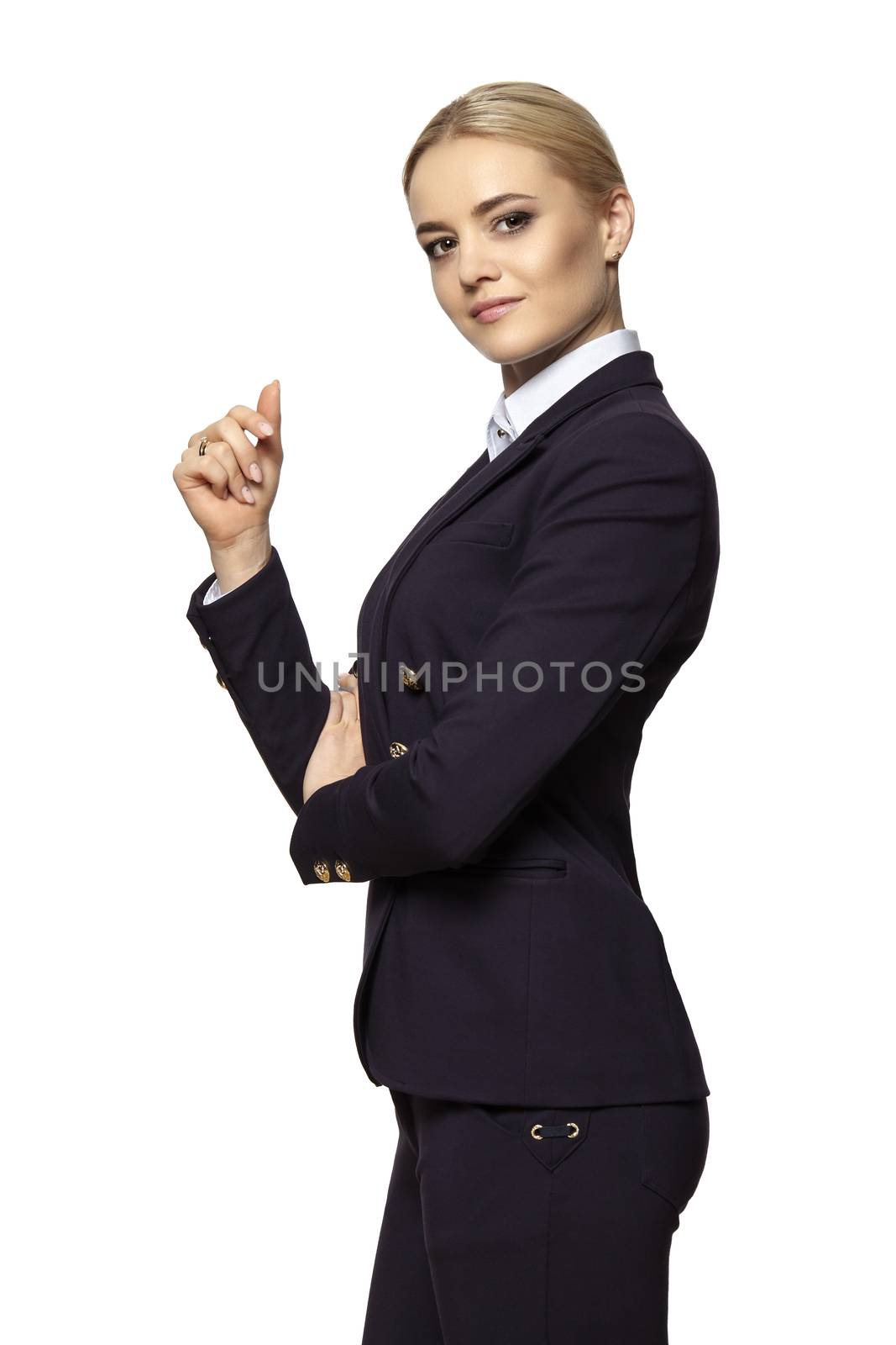 Studio portrait of a serious blonde business woman with raised hand. Isolated on white background.