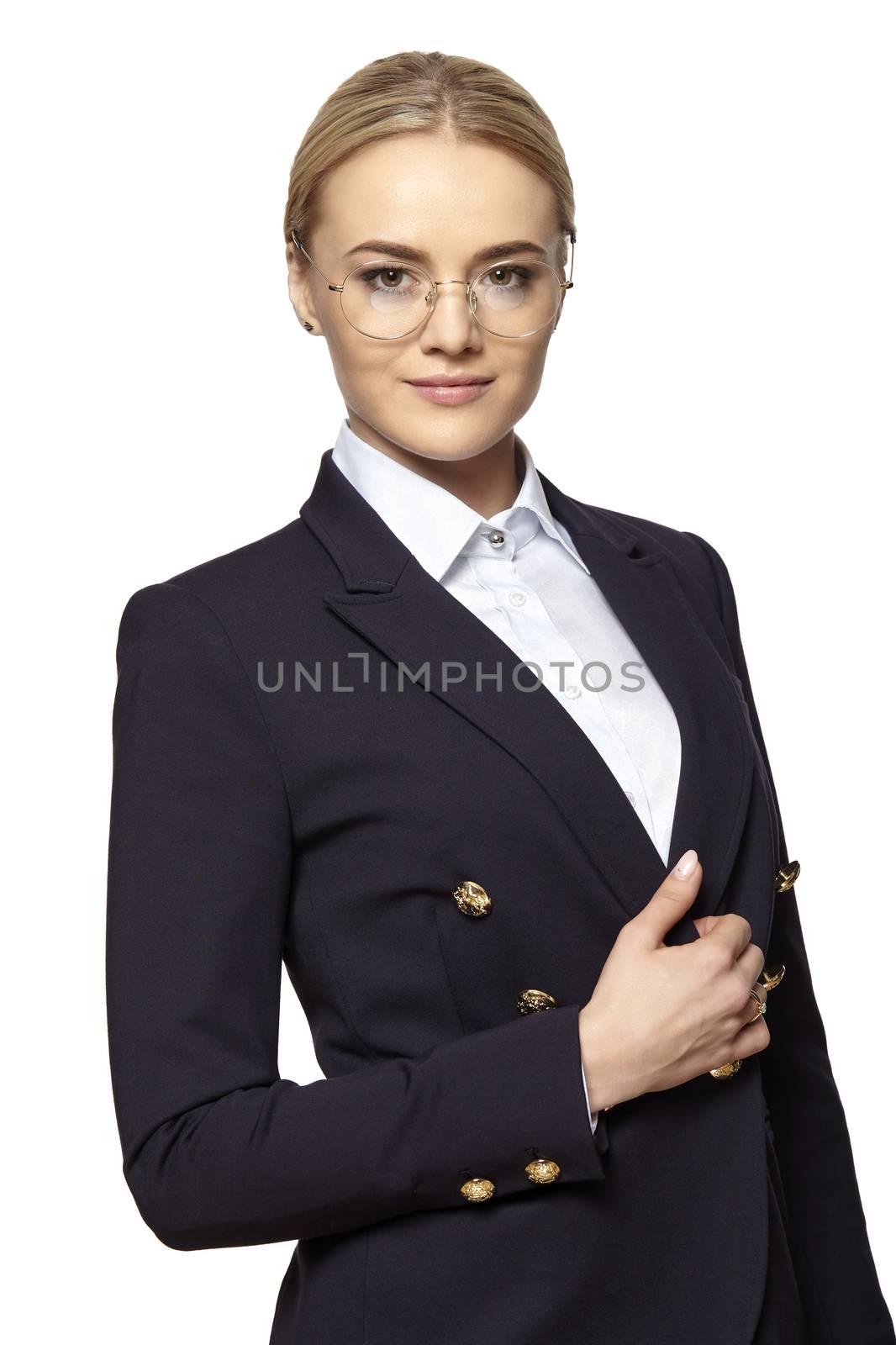 Portrait of young beautiful blonde woman in a gold eyeglasses and dark business suit.