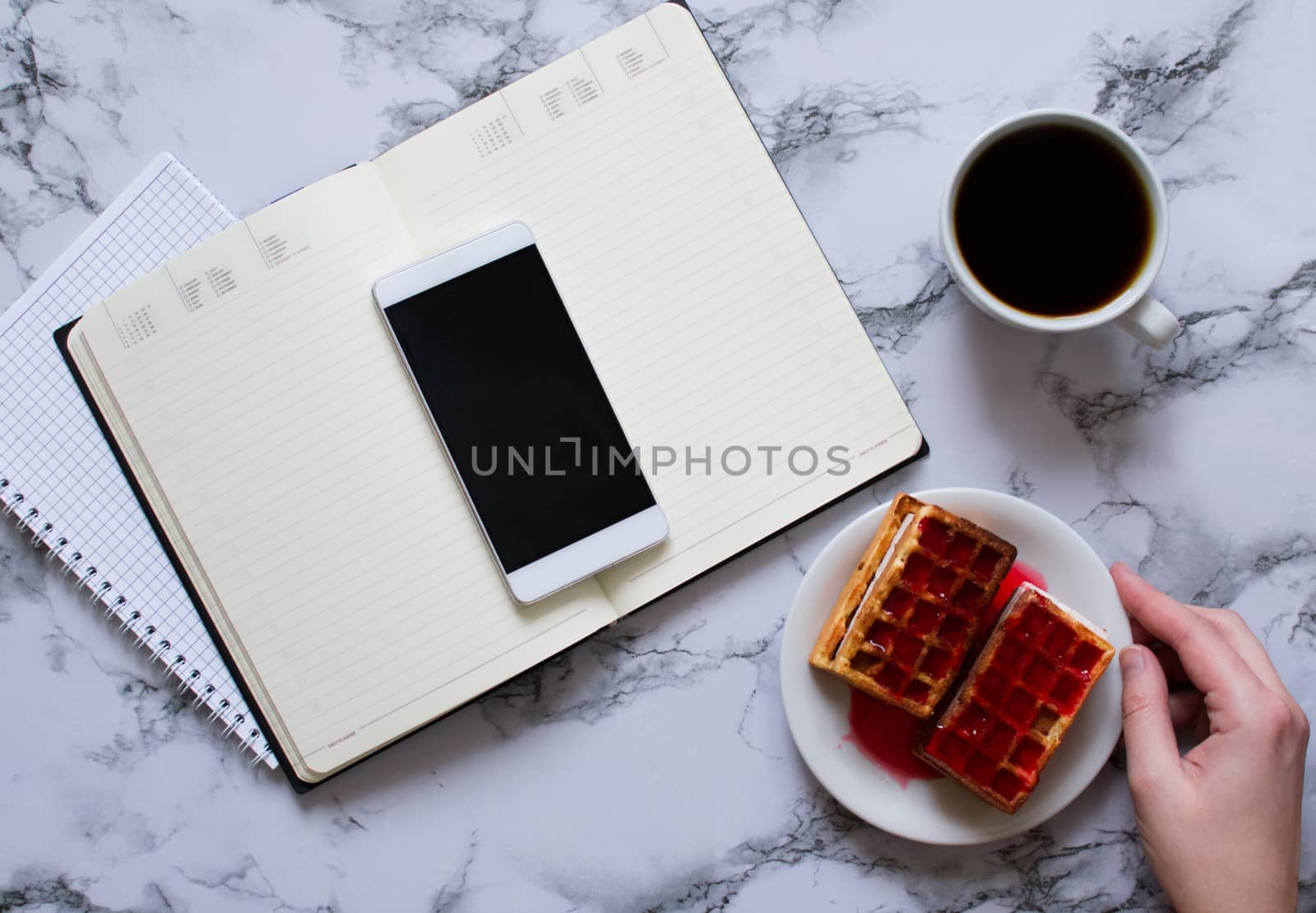 Woman are planning the day, coffee, waffles, marble background