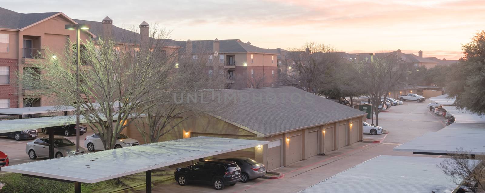 Panorama view typical aerial of apartment complex with detached garage and covered parking lots in Texas, America