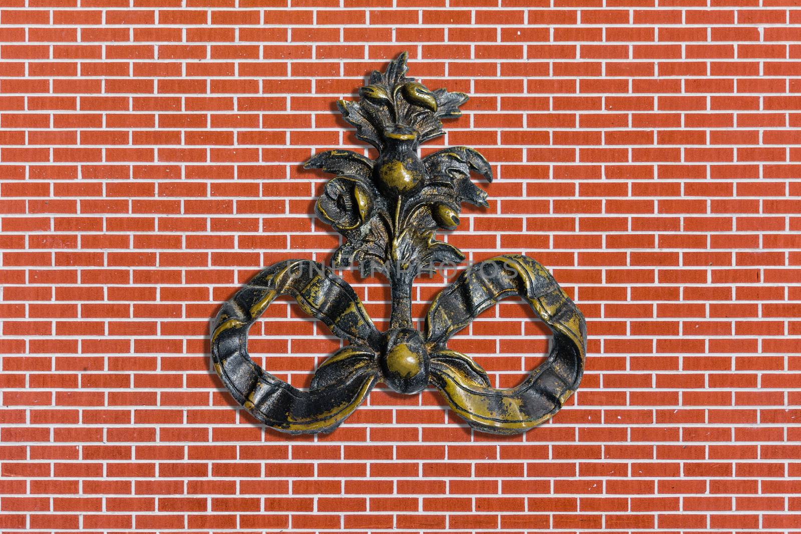 Old minted monogram on red brick wall by ben44