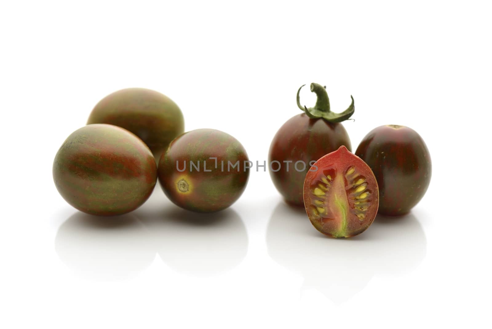 Black zebra tomatoes  on a white background