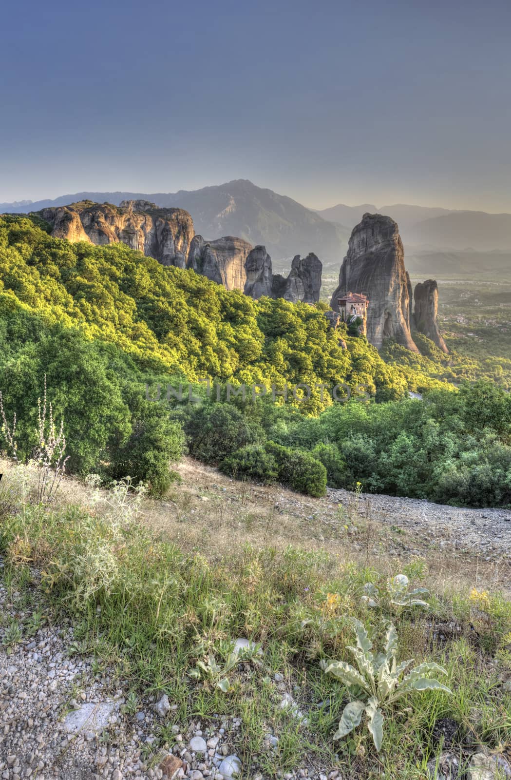 Panoramic view of the Rousanou Monastery in Meteora, Kalambaka town in Greece, on a sunny summer evening