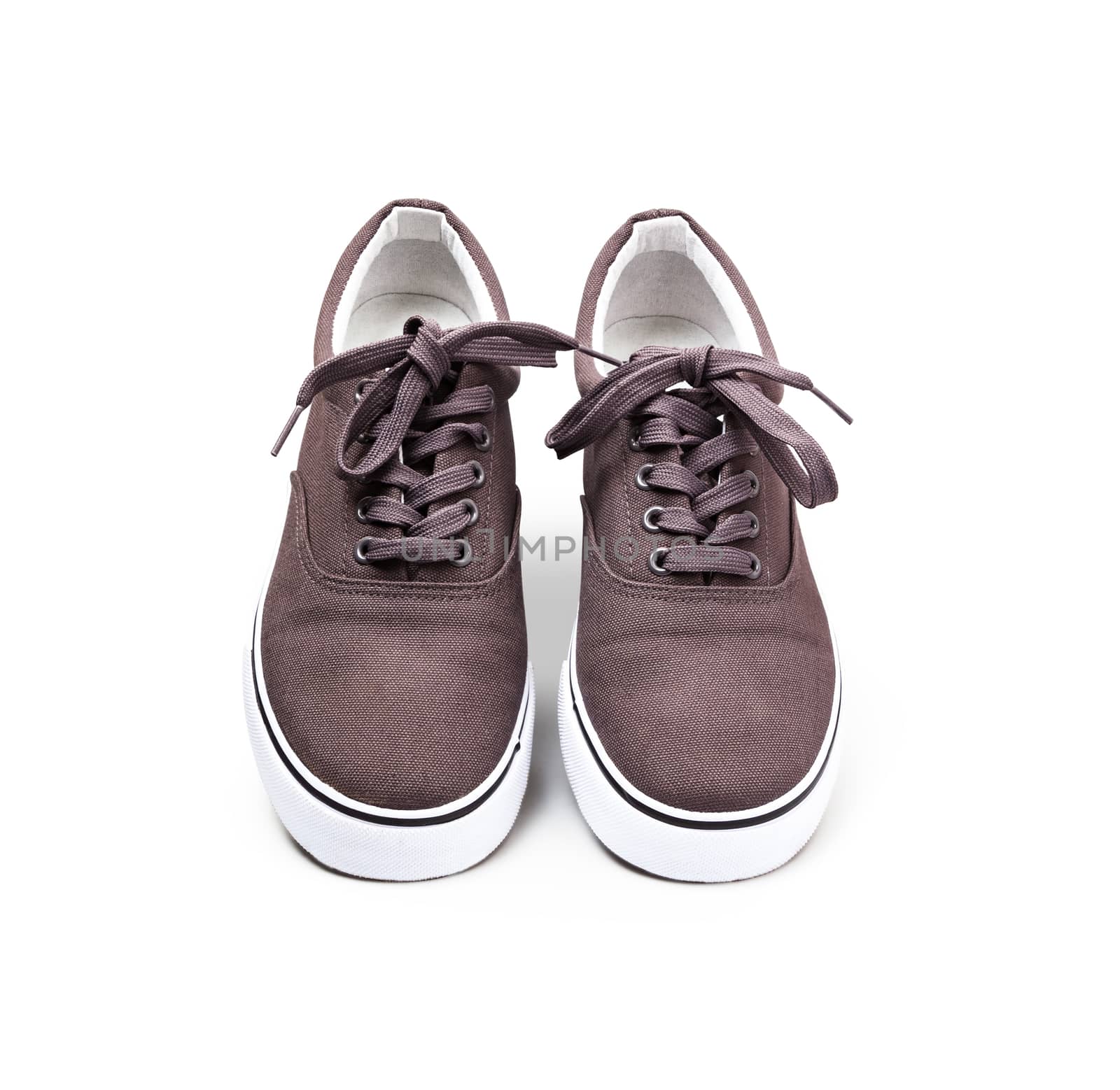A pair of brown canvas shoes isolated on white background with clipping path