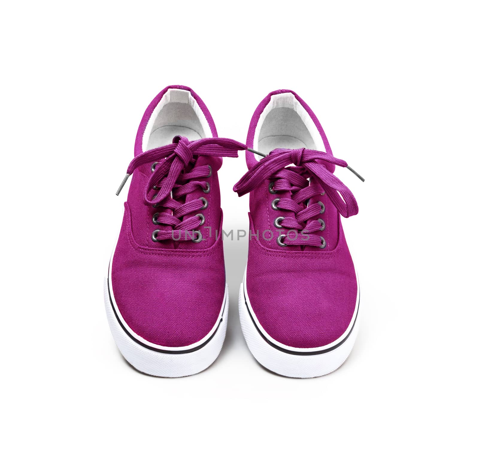 A pair of pink color canvas shoes isolated on white background with clipping path