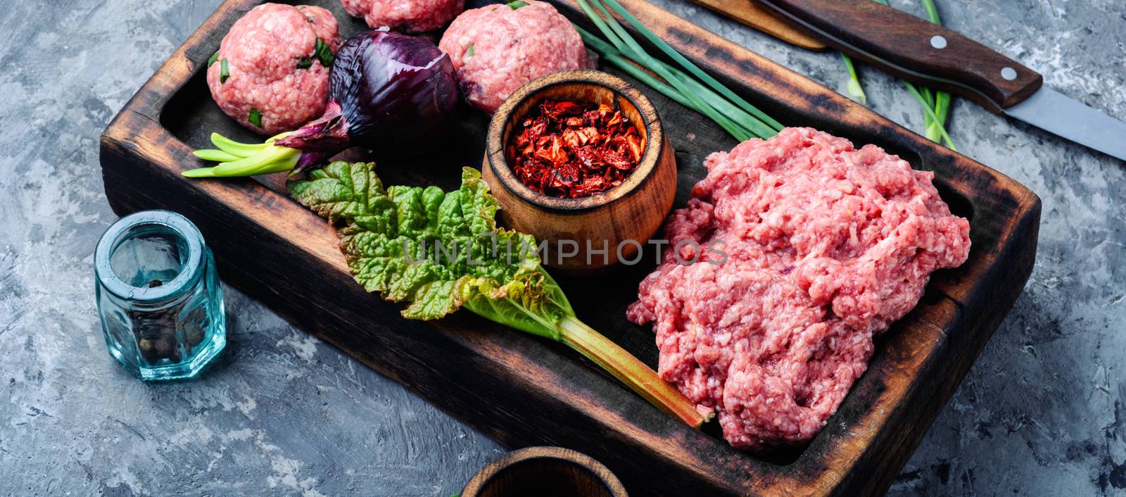 Meat balls from raw beef force-meat on kitchen board.Raw ground beef meat