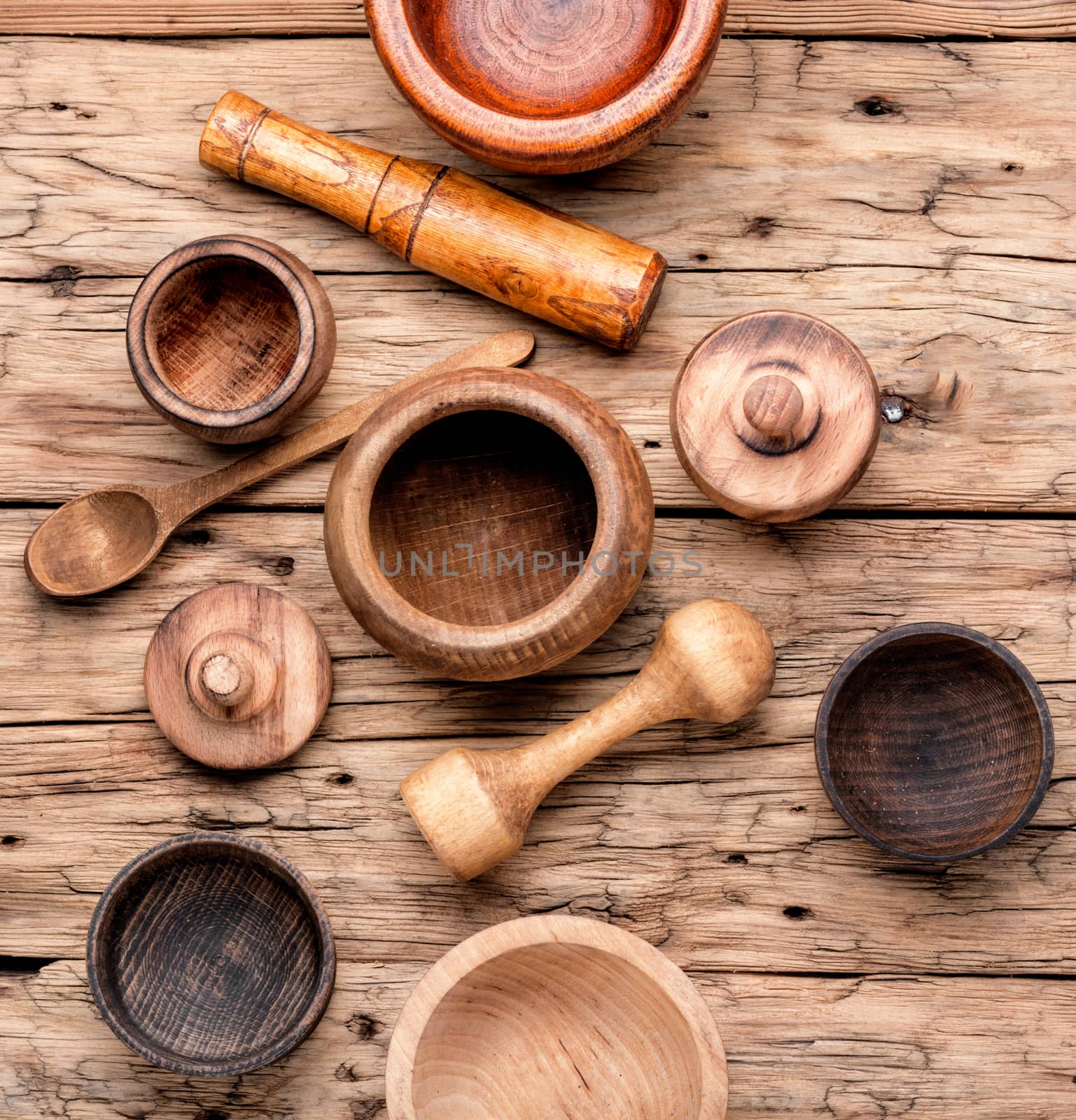 Empty wooden mortar and pestle on wooden old background.Cooking utensils.Mortar with pestle