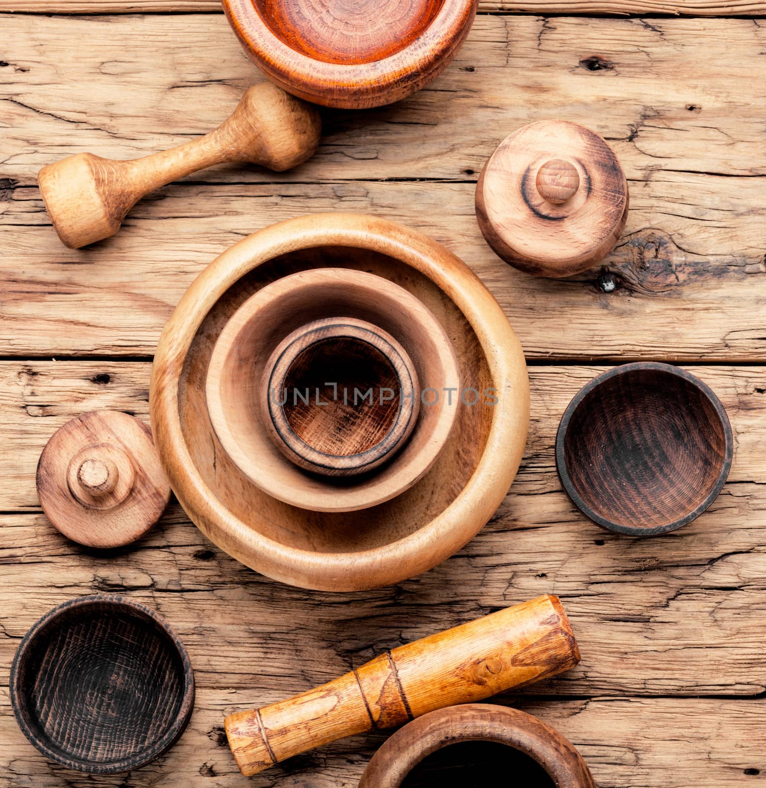 Empty wooden mortar and pestle on wooden old background.Cooking utensils.Mortar with pestle