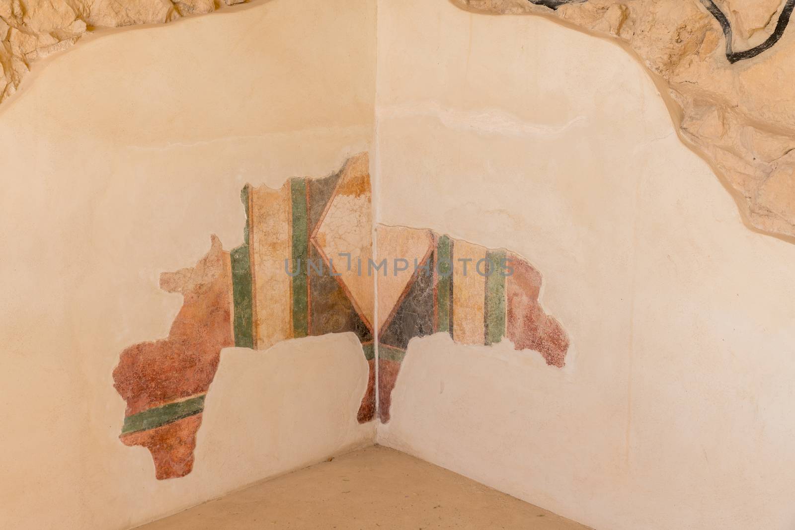 leftovers of old wall paintings at the ruins of the ancient Masada fortress in Israel,build by Herod the great
